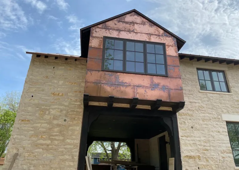 Copper metal panel facade on a stone building for Roof Repair in Hardeeville